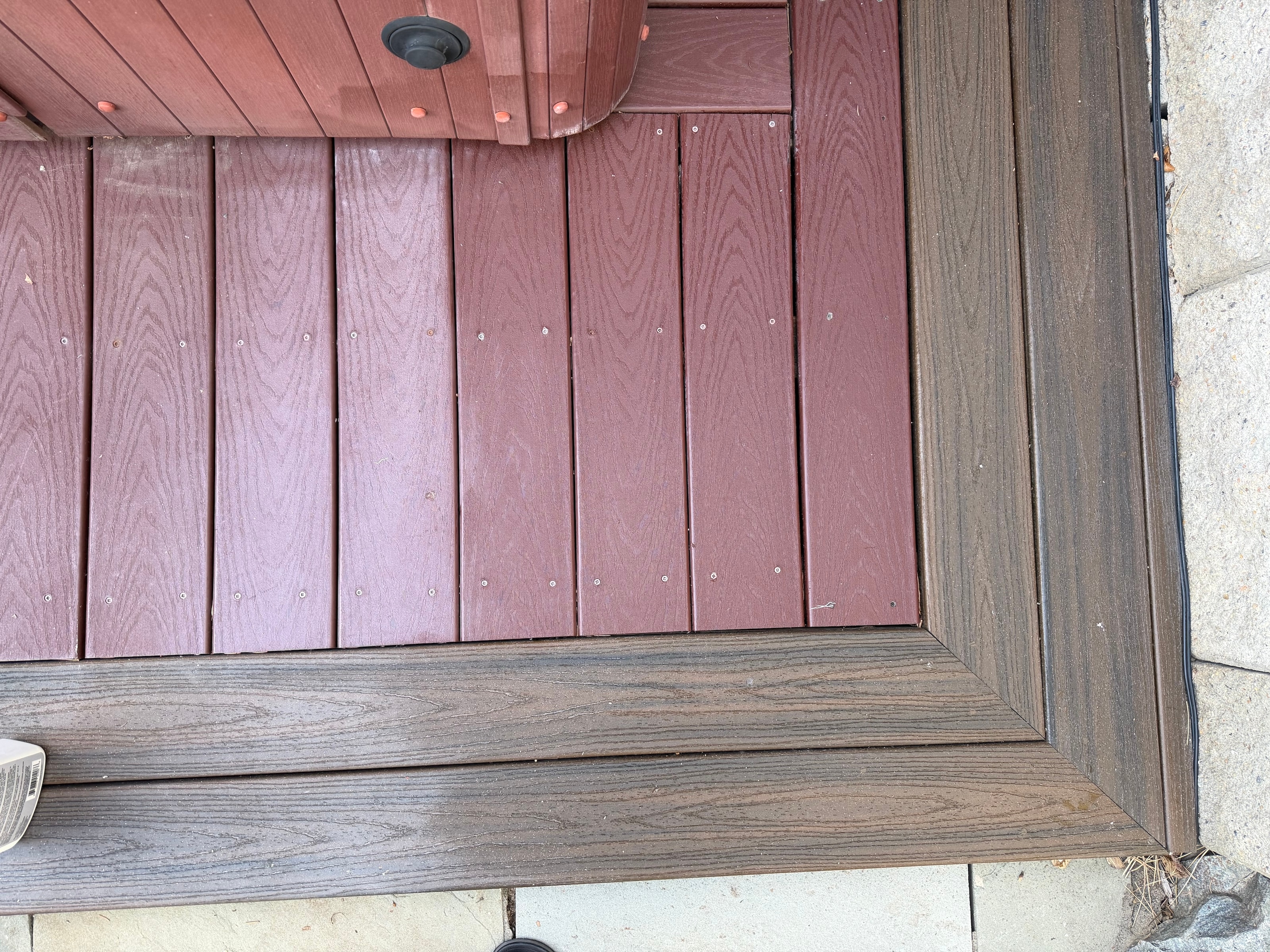 Composite deck transformation showing faded and restored boards side by side